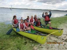 A group of children in canoes