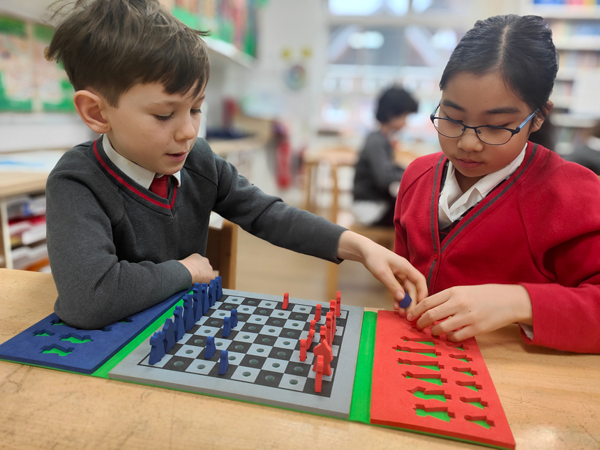 children playing chess in a classroom