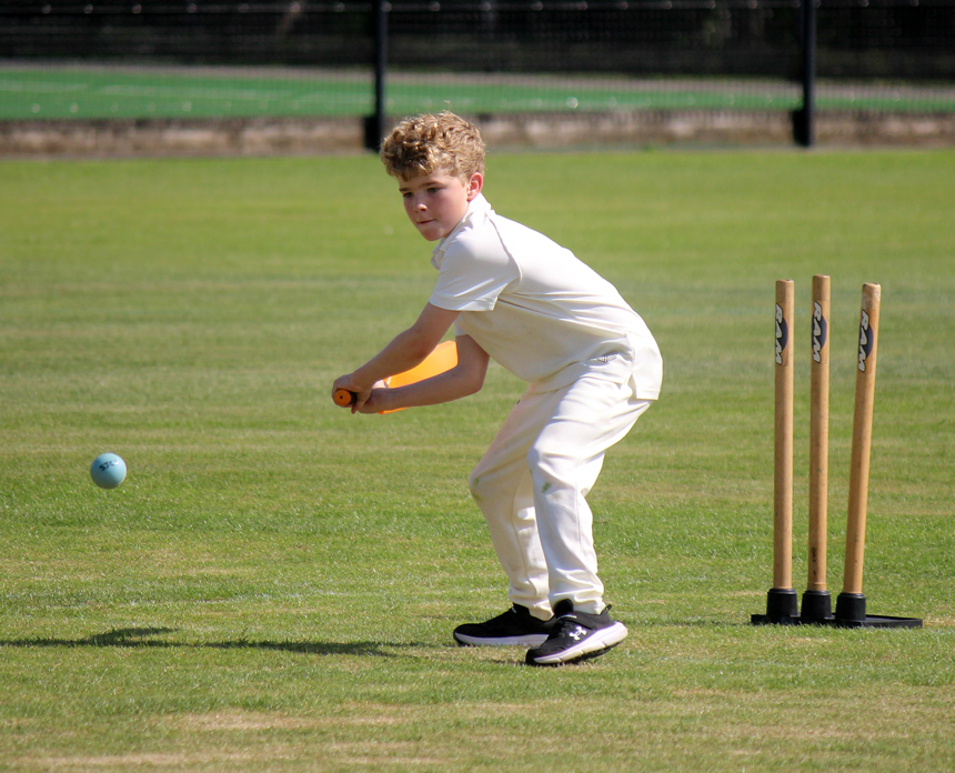 boy playing cricket