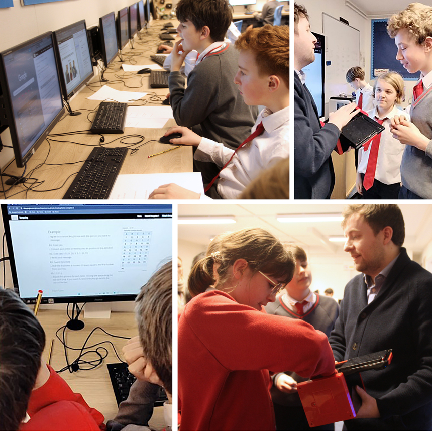 children in a classroom working at computers