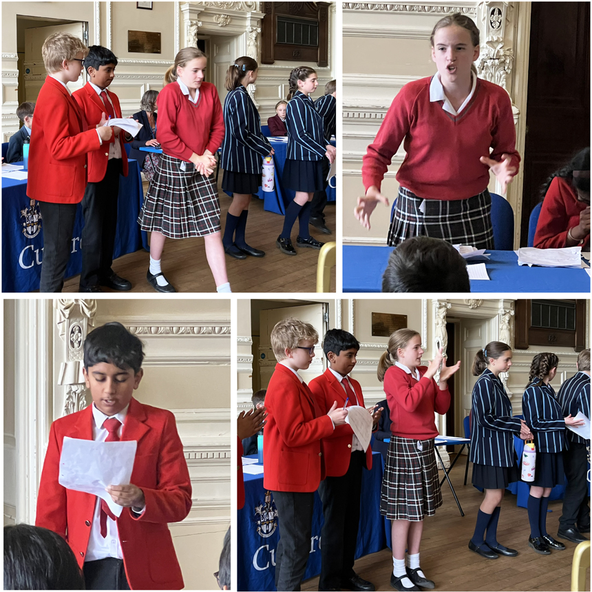 children taking part in a debating competition at a school