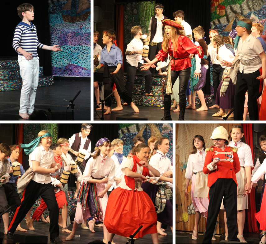 children acting on a stage in costumes