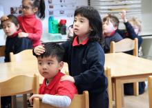 children giving each other a peer to peer massage