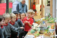 children looking at harvest produce