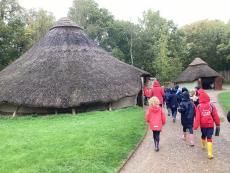 children walking around an iron age fort