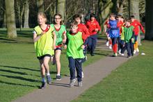 Children running in the park.