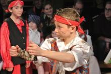 children dressed as pirates acting in a play