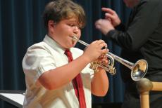 boy performing a trumpet solo