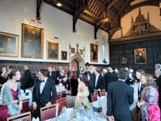 guests at a smart dinner in a college hall