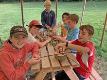 children sitting at a picnic table