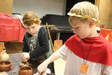 2 boys dressed in Roman costumes