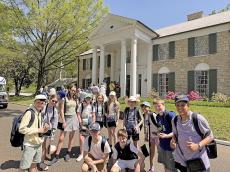 a group of children outside Elvis Presley's house