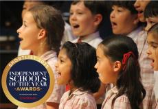 children singing at a concert hall