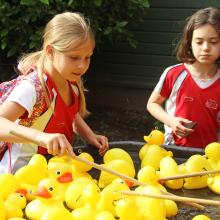 two girls playing hook a duck