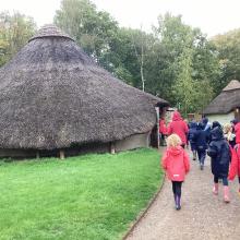 children walking around an iron age fort