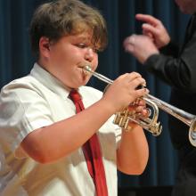 boy performing a trumpet solo