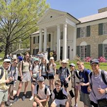 a group of children outside Elvis Presley's house