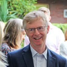 headmaster smiling talking to parents outside